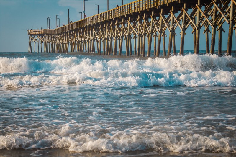 Waves crashing near Surf City pier on Topsail Island near Hampstead, NC
