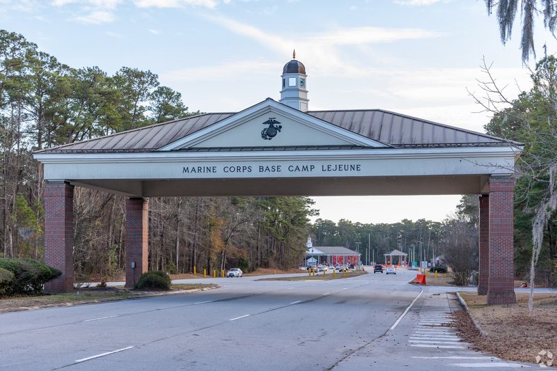 The brick entrance sign for Camp Lejeune with the Marine Corps emblem in Jacksonville, NC.