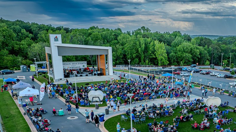 Outdoor concert event at Mosaic in Pittsboro, North Carolina with crowd gathered near stage