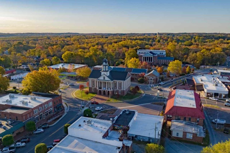 Aerial view of downtown Pittsboro, North Carolina showcasing courthouse and surrounding buildings in fall