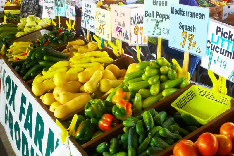 Fresh vegetables and produce display at a farmers market in Raleigh, North Carolina.