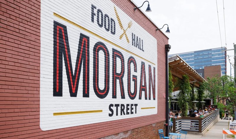 Morgan Street Food Hall exterior with large painted signage and patio seating in Raleigh, North Carolina.