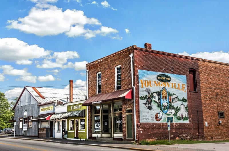 Downtown Youngsville streetscape with historic storefronts and mural in Youngsville, North Carolina.