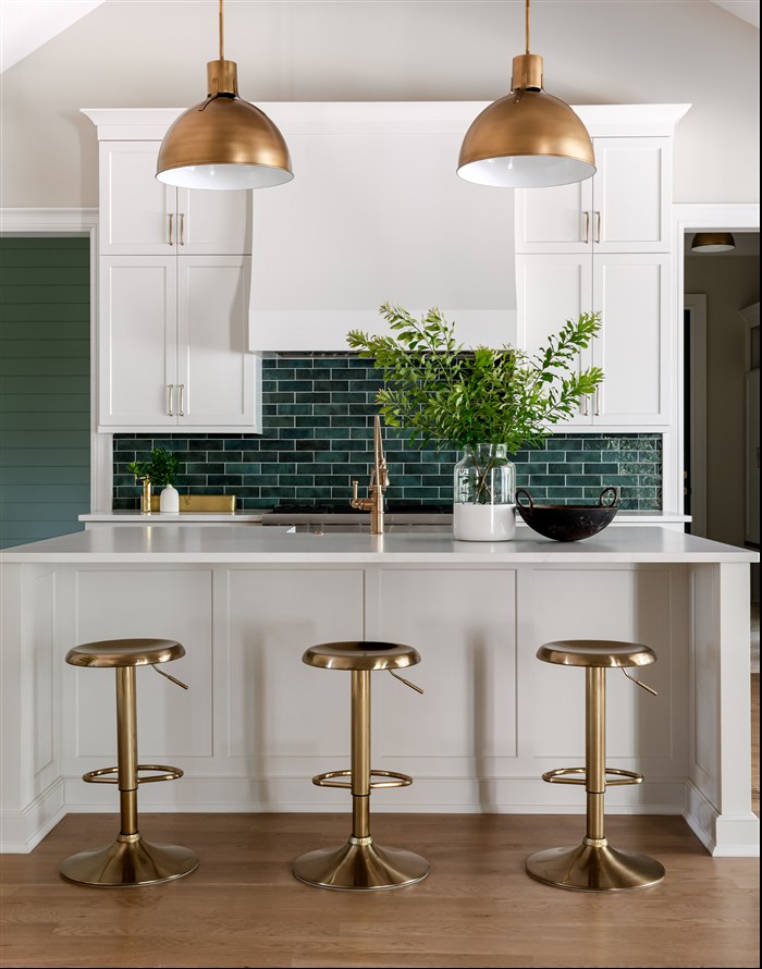 Bright kitchen with brass pendant lighting